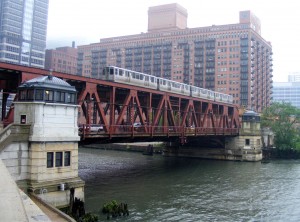 A train heading west across the Lake Street Bridge over the Chicago River